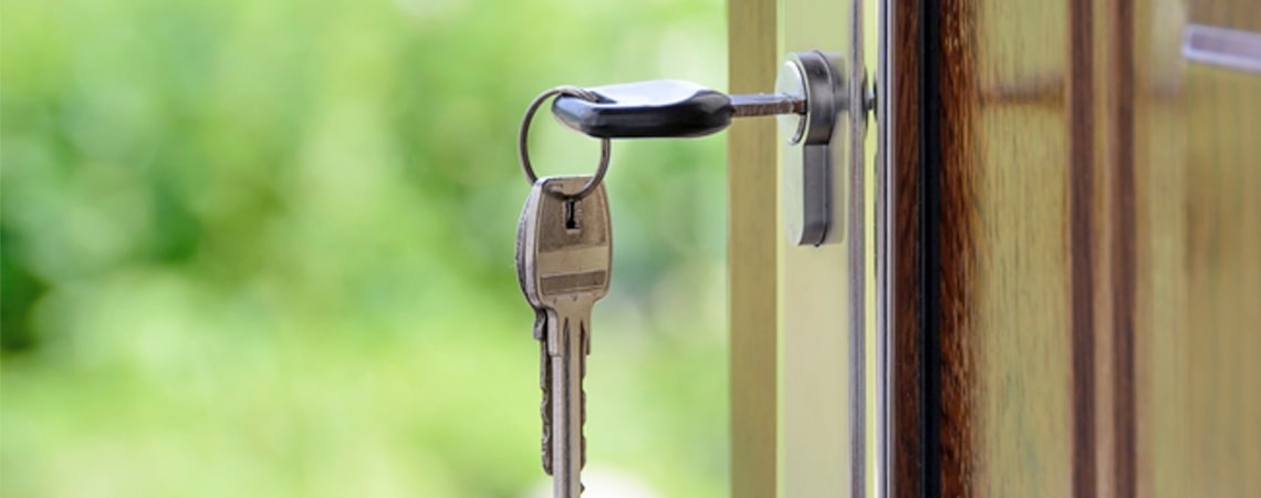 Key hanging from a front door lock